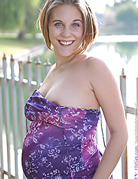 Pregnant babe Violet is wearing a sexy maternity dress made from a loose fitting
