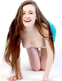 Emily Bloom strips and shows off her smoking-hot body today.