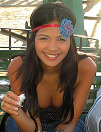 Karla Spice is at the arcade having fun and she looks terrific in her low cut top.